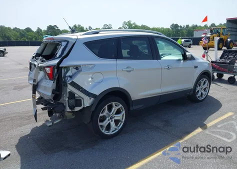 2019 Ford Escape Titanium z USA, uszkodzony, nr VIN 1FMCU0J99KUA87399